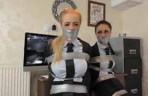 Two whores tied up in ducktape in a bondage video