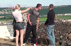 Young cute blonde teen cooky PUBLIC threesome at a constructi